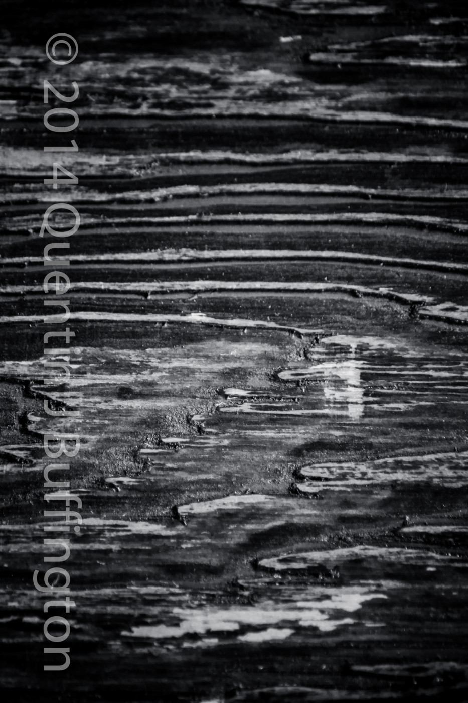A close up of some wood showing a texture that almost looks like lines on a map.